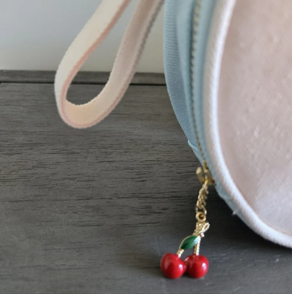 Marc Jacobs Cream Round Cosmetic Bag with Cherry Charm